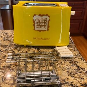 Nostalgia Grilled Cheese Sandwich Toaster. Used a few times. Still have the box!